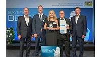 ViscoTec executives receive Bavaria's Best 50 award Picture of four men and one woman holding an award shaped like a lion