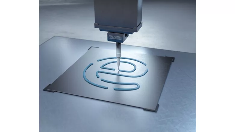 Picture of silicon being dispensed on a metal plate