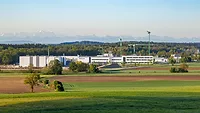 DELO building in the Alps Picture of industrial building with mountains in the background