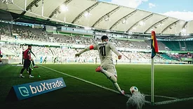 Picture of a soccer player kicking a ball
