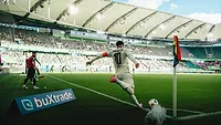 Picture of a soccer player kicking a ball