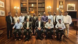 Picture of men standing and sitting for a group photo