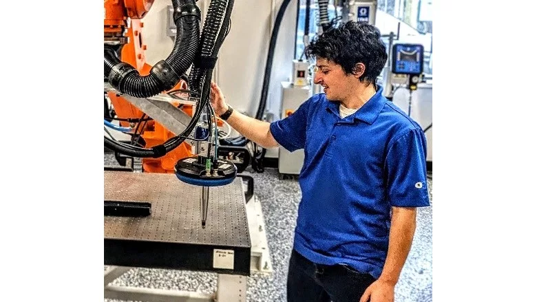 Picture of a student with a dispensing equipment