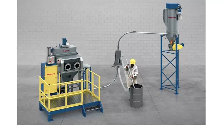 Picture of a man standing next to a vacuum conveying system