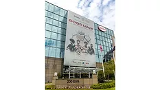 Picture of a buiding with a large banner with soccer players