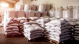 A large group of bags in a warehouse. 