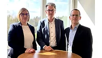 Executives at Jowat Swiss Facility Picture of two men in suits and a woman