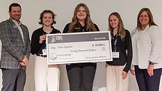 A picture of people receiving a large check