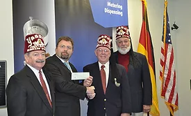 Scheugenpflug-donates-to-the-Shriners-Hospital.jpg