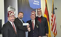 Scheugenpflug-donates-to-the-Shriners-Hospital.jpg