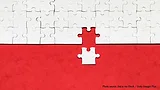 white puzzle piece added to larger puzzle on red background