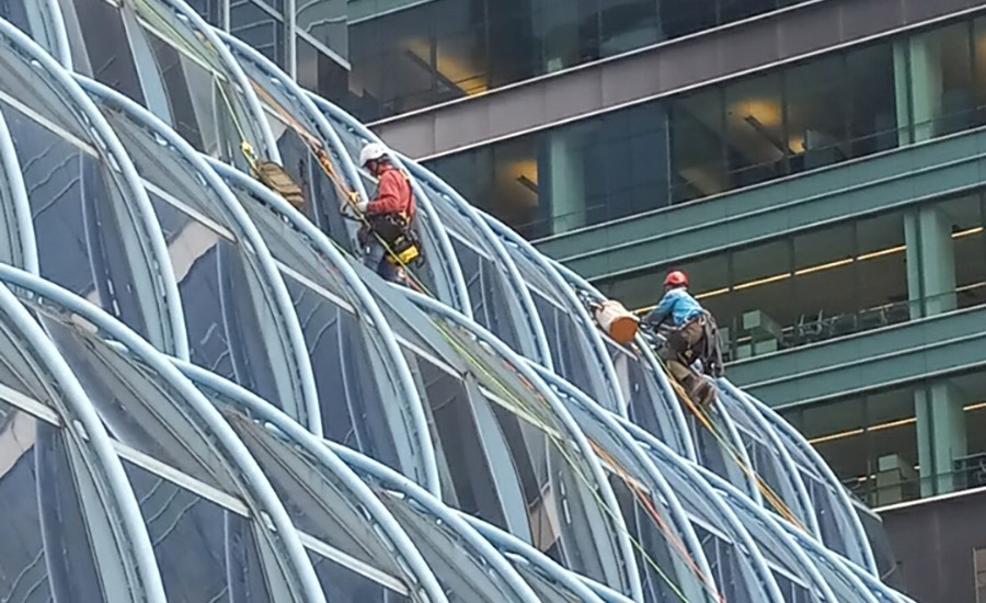 Western Specialty Contractors workers on Accenture Tower.