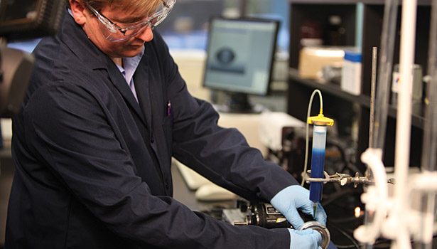man working with sealant coatings lab