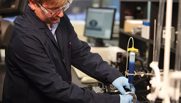 man working with sealant coatings lab