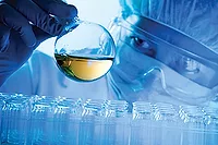 PSTC Person in Lab ft person in lab safety glasses