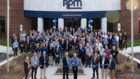 Photo of people standing in front of RPM Innovation Center ribbon-cutting ceremony.